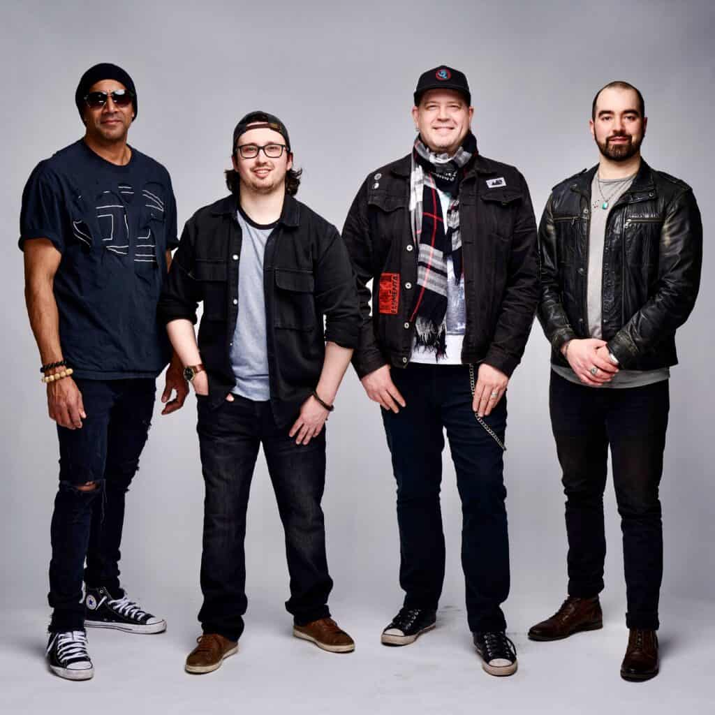 Band The Quickness playing energetic music on stage.
